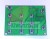 Zelená deska s plošnými spoji PCB s několika černými hmatovými tlačítkovými spínači.